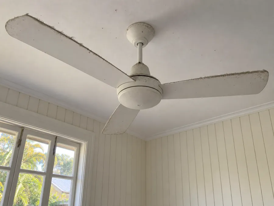 Dusty ceiling fan before a professional bond clean in Brisbane