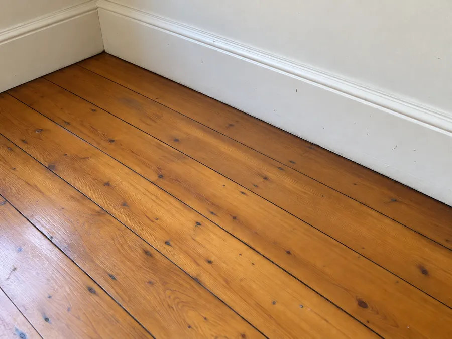Clean hoop pine floor after a professional bond clean in Brisbane