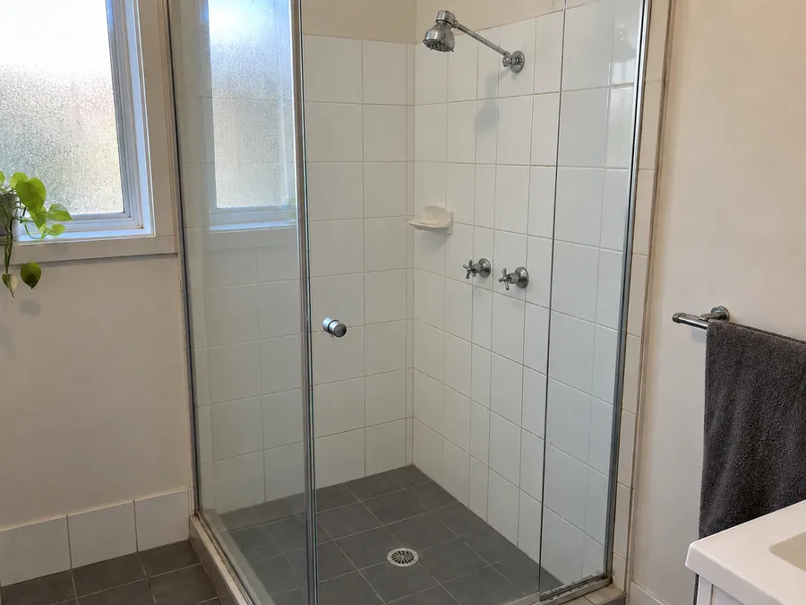 Clear shower screen and clean grout after a professional bond clean