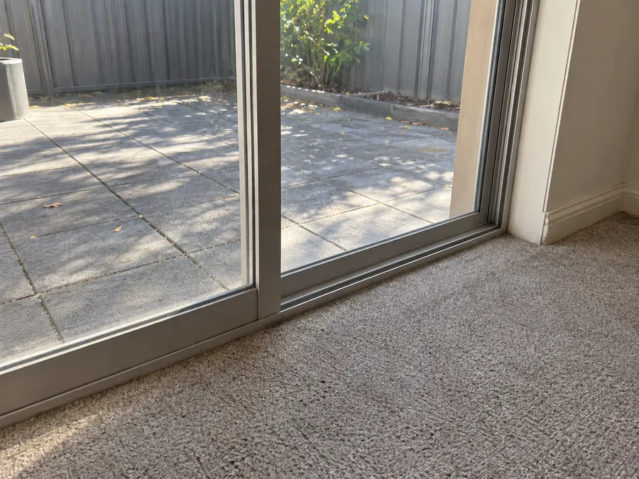 Clean sliding glass door and track after a professional bond clean