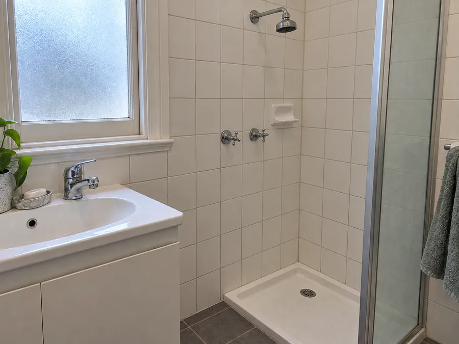 Clean bathroom tiles and grout after an end of lease clean in Melbourne