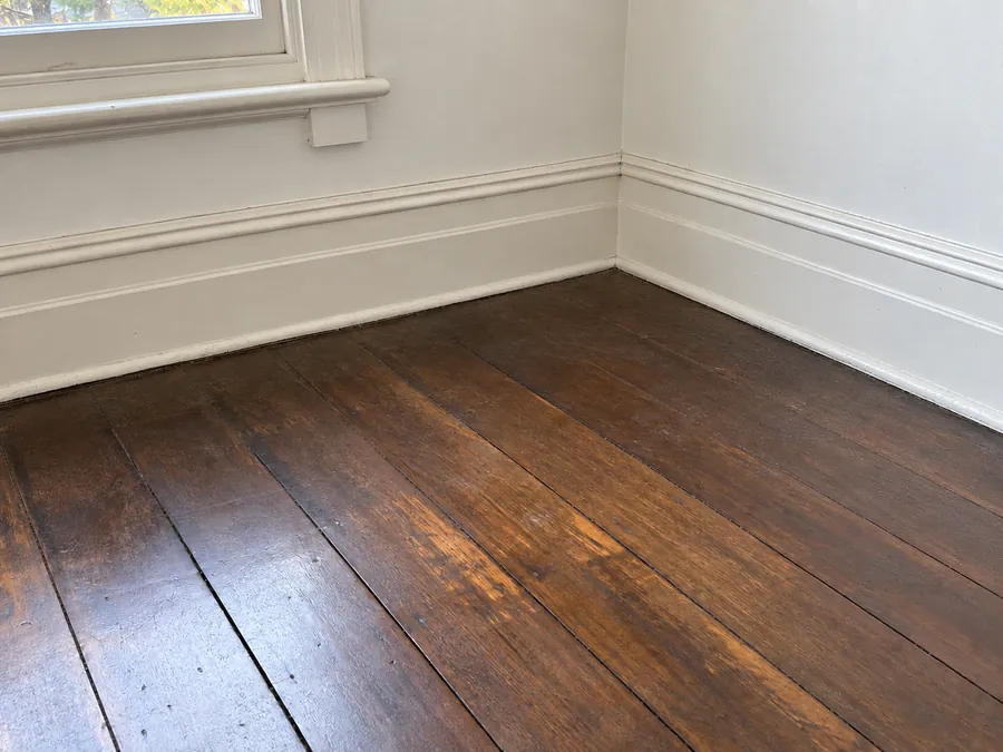 Clean aged timber floor edges after an end of lease clean in Melbourne