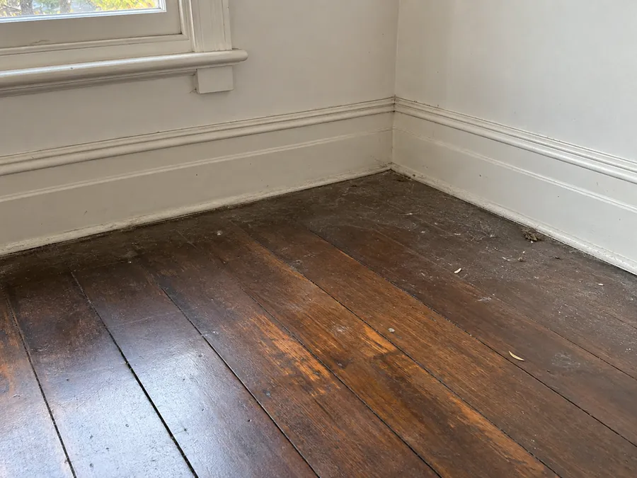 Dusty timber floor edges before an end of lease clean in Melbourne
