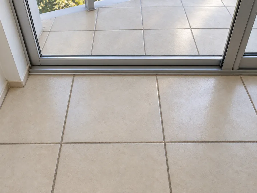 Clean tiled floor and balcony track after an end of lease clean in Sydney