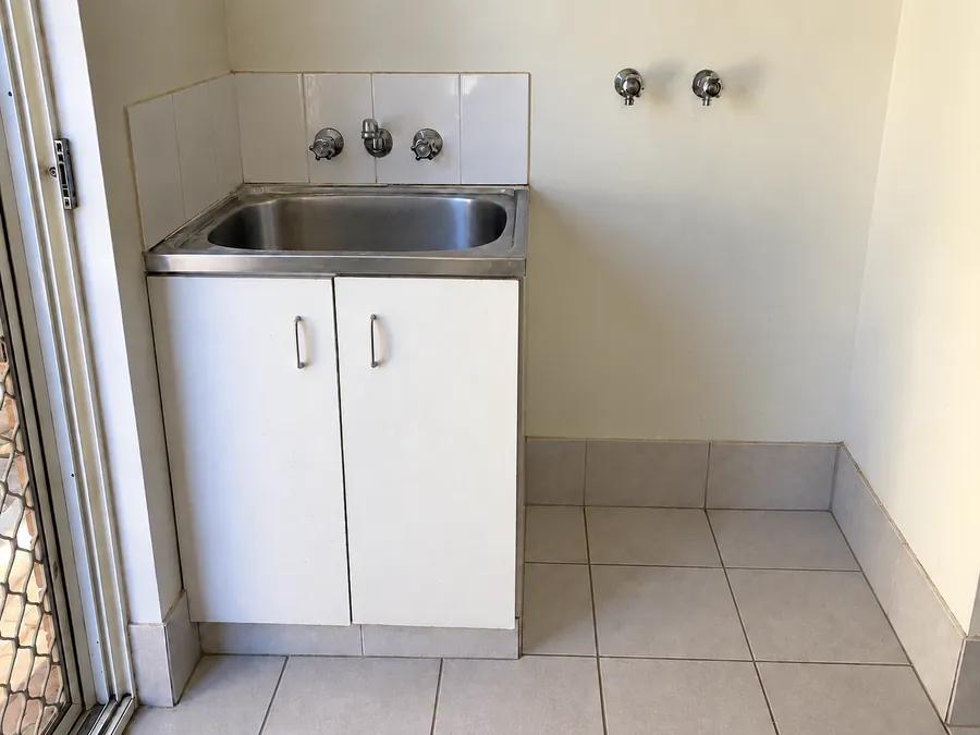 Clean rental laundry sink and floor after a Perth vacate clean