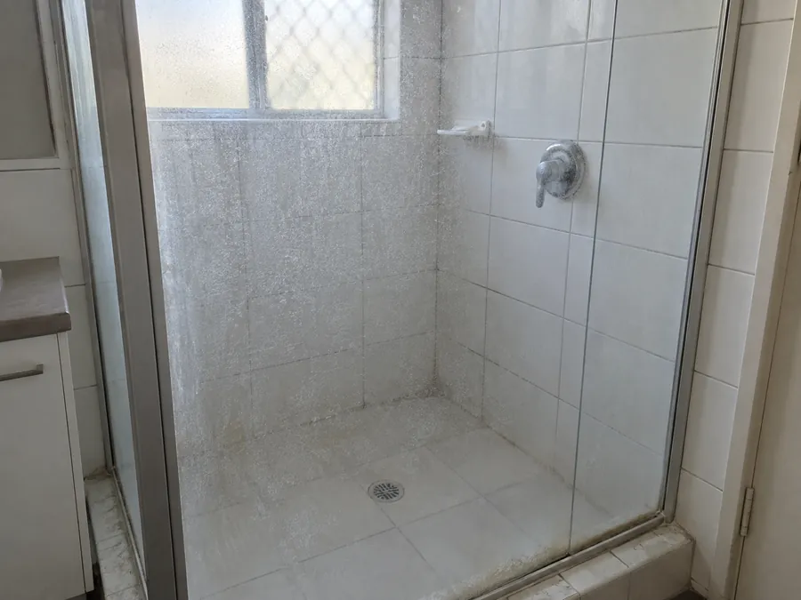 Scaled shower screen before a Perth end of lease clean